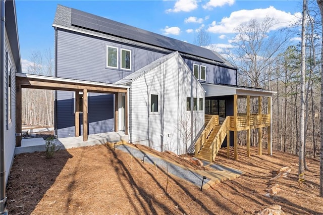 back of property with solar panels