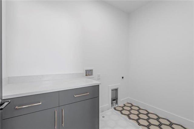 laundry area featuring cabinets, hookup for a washing machine, and electric dryer hookup