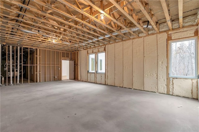 miscellaneous room with plenty of natural light and concrete floors