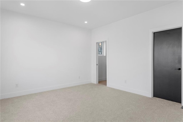 unfurnished bedroom with light carpet