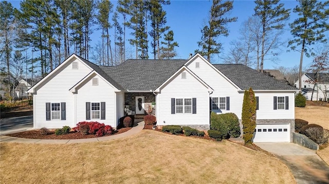 ranch-style home with a garage and a front lawn