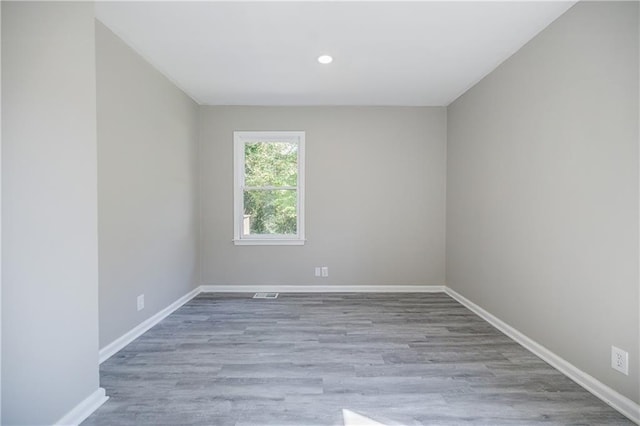 unfurnished room featuring light hardwood / wood-style floors