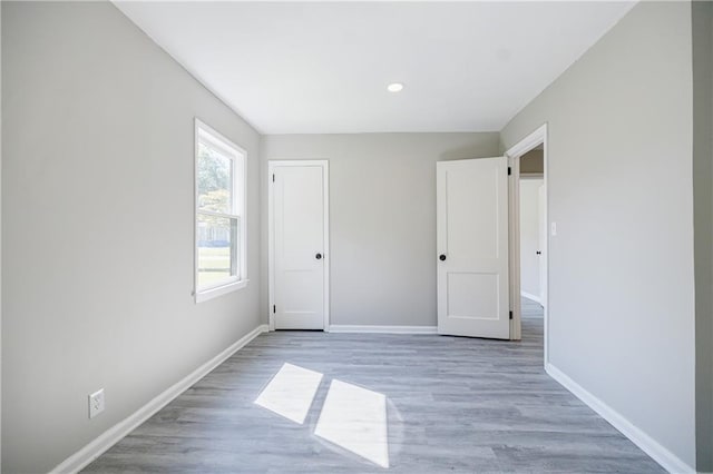 unfurnished bedroom featuring light wood-type flooring