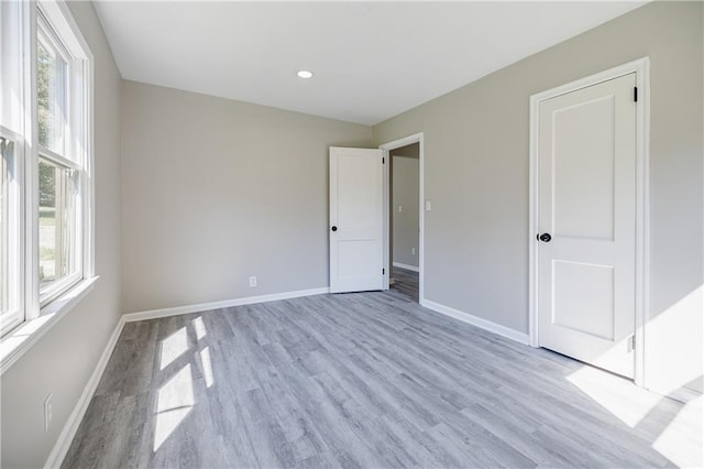 unfurnished bedroom with light hardwood / wood-style floors