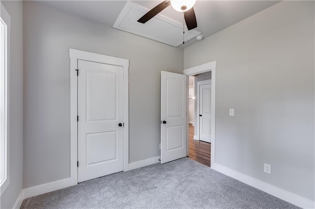 unfurnished bedroom featuring ceiling fan and light carpet