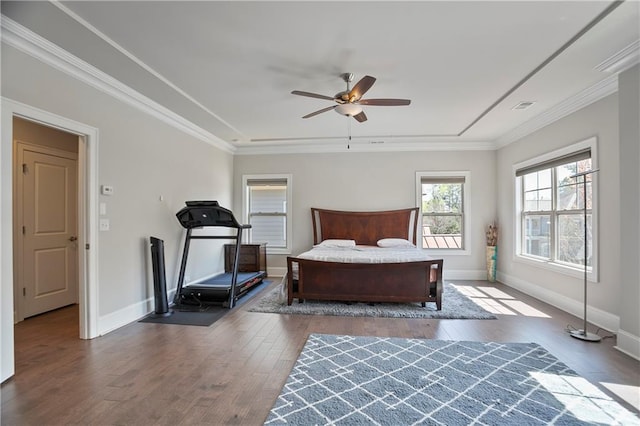 bedroom featuring hardwood / wood-style flooring, baseboards, and ornamental molding