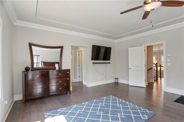 bedroom with dark wood-style floors, ornamental molding, baseboards, and a ceiling fan