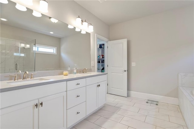 full bath featuring a shower stall, marble look tiles, double vanity, a bath, and baseboards