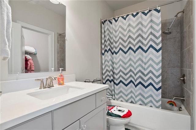 bathroom with shower / tub combo, vanity, and toilet