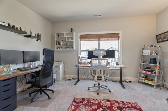 office space with carpet and baseboards