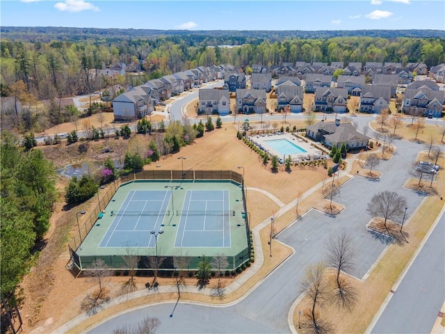 aerial perspective of suburban area featuring a pool area
