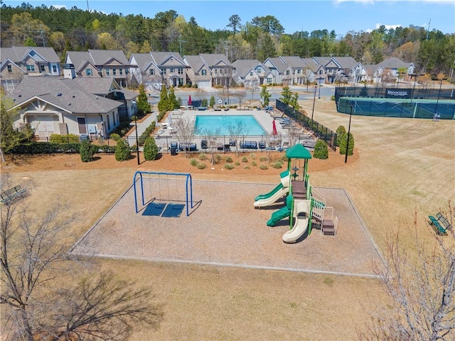 aerial perspective of suburban area featuring a pool area