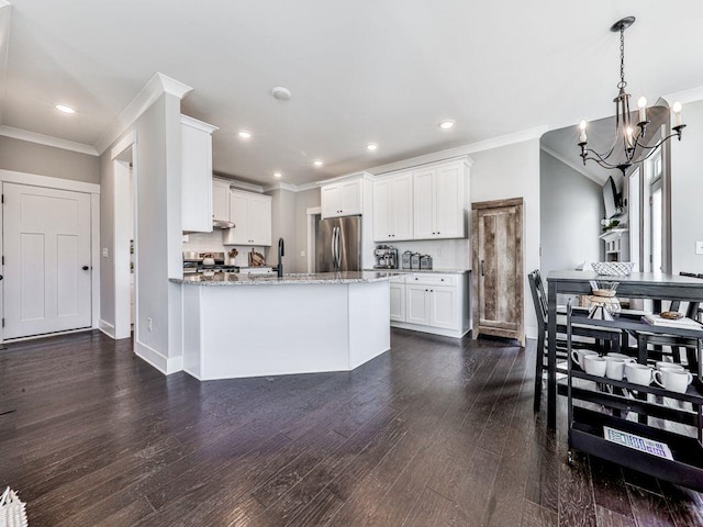 711 Carver Mill Rd, Talking Rock, GA 30175 - kitchen featuring stainless steel refrigerator, ornamental molding, light stone counters, dark wood-style flooring, and a chandelier