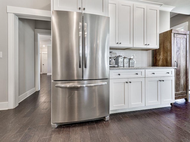 711 Carver Mill Rd, Talking Rock, GA 30175 - kitchen with freestanding refrigerator, dark wood finished floors, white cabinets, tasteful backsplash, and light stone counters
