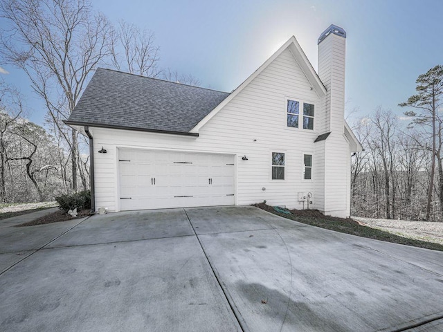 711 Carver Mill Rd, Talking Rock, GA 30175 - view of side of property with roof with shingles, driveway, a chimney, and a garage