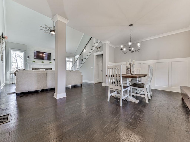 711 Carver Mill Rd, Talking Rock, GA 30175 - dining room with healthy amount of natural light, a chandelier, stairs, wood finished floors, and a decorative wall