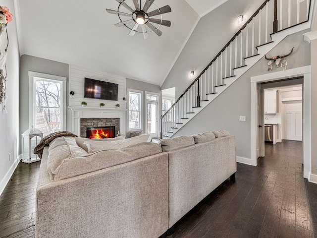 711 Carver Mill Rd, Talking Rock, GA 30175 - living area with a fireplace, dark wood-style flooring, a ceiling fan, stairs, and high vaulted ceiling