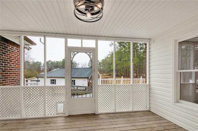 unfurnished sunroom featuring plenty of natural light