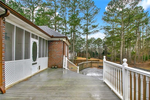 wooden terrace with a sunroom