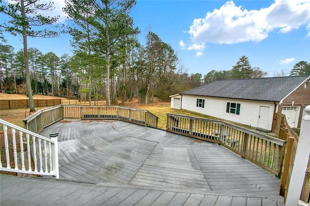 deck with fence and an outdoor structure