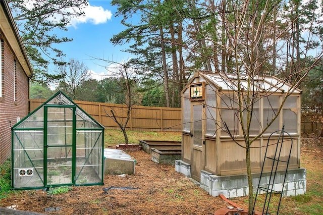 exterior space featuring fence and a vegetable garden