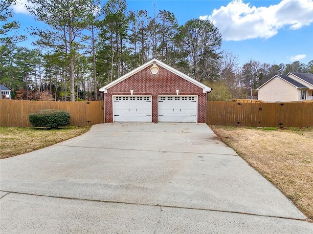 garage with fence and a gate