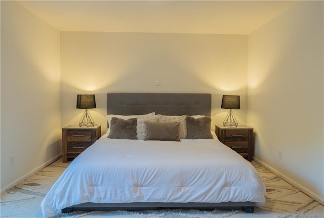 bedroom with carpet floors and baseboards