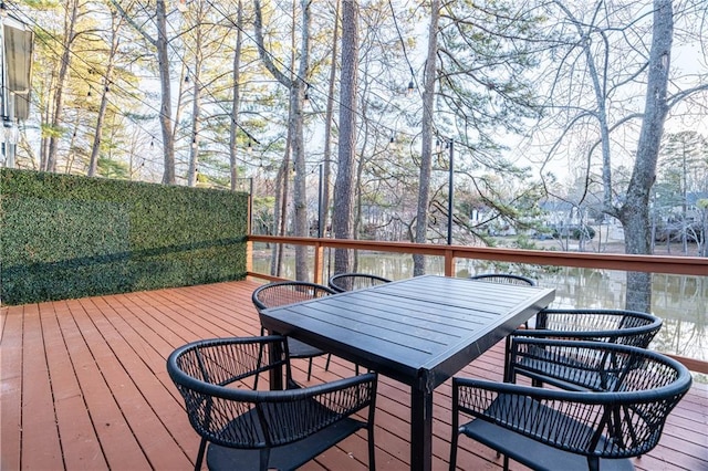 wooden terrace featuring outdoor dining space