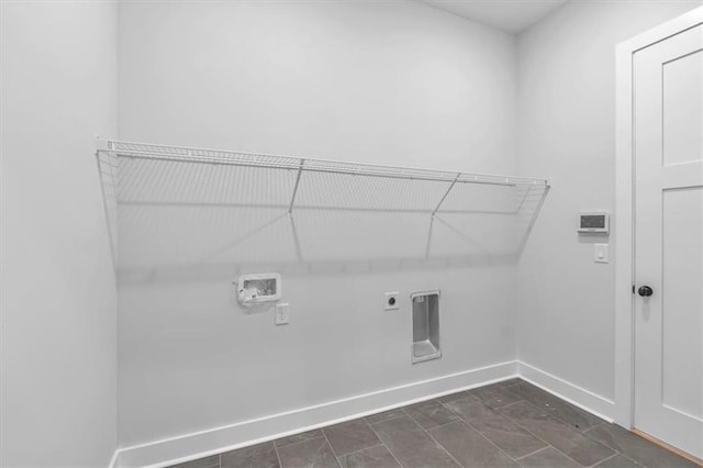 laundry area with baseboards, washer hookup, and electric dryer hookup