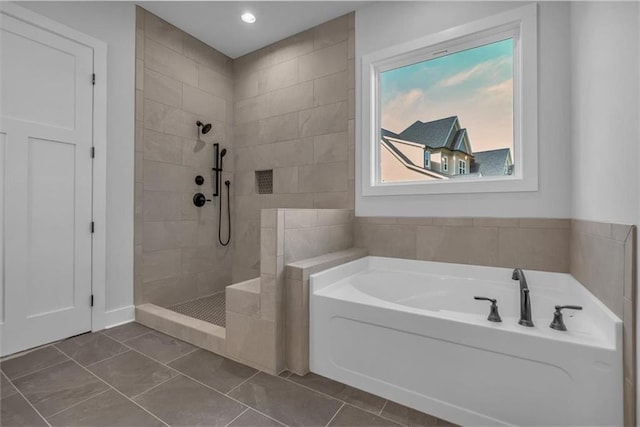 full bath with tiled shower, a garden tub, and tile patterned floors