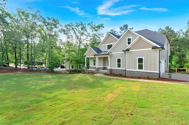 craftsman inspired home with board and batten siding and a front lawn