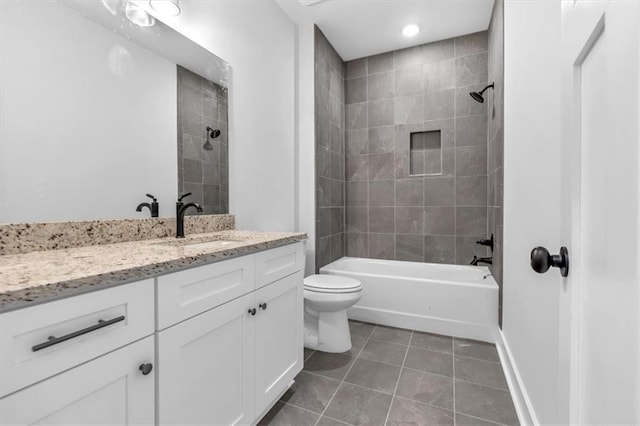 full bath with tile patterned floors, vanity, shower / bathtub combination, toilet, and baseboards