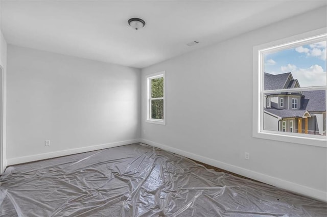 empty room with baseboards