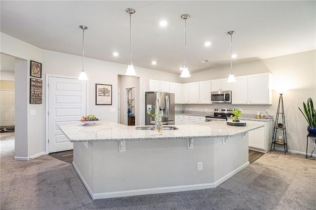 11 Rambling Oaks Dr NE, Rome, GA 30165 - kitchen with stainless steel appliances, dark carpet, white cabinetry, a large island, and recessed lighting