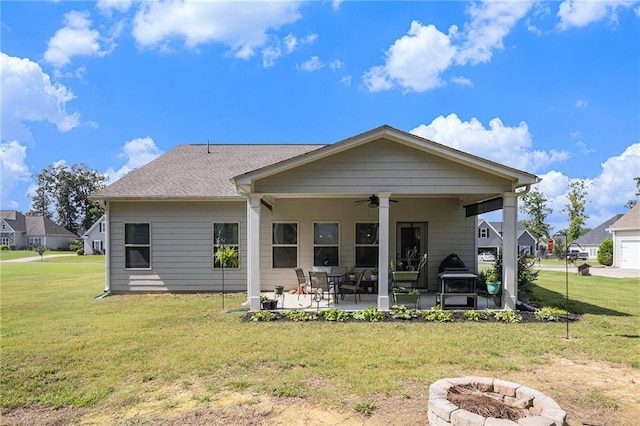 11 Rambling Oaks Dr NE, Rome, GA 30165 - rear view of property featuring an outdoor fire pit, ceiling fan, a patio area, and a lawn
