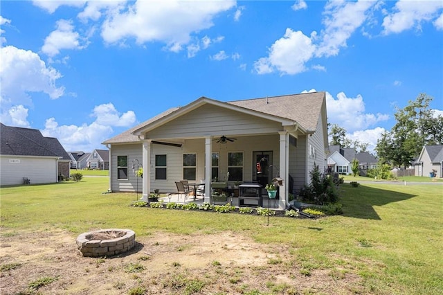 11 Rambling Oaks Dr NE, Rome, GA 30165 - back of property with a ceiling fan, an outdoor fire pit, a patio area, and a lawn