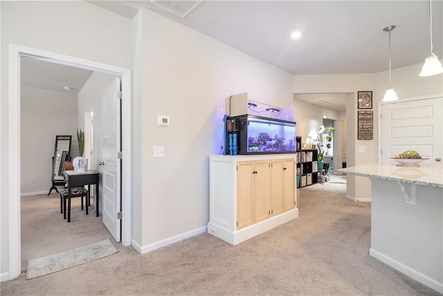 11 Rambling Oaks Dr NE, Rome, GA 30165 - kitchen featuring light colored carpet, light stone countertops, a breakfast bar, and decorative light fixtures