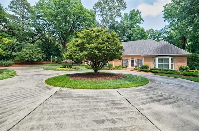 3030 Spalding Dr, Sandy Springs, GA 30350 - view of front facade featuring curved driveway and brick siding