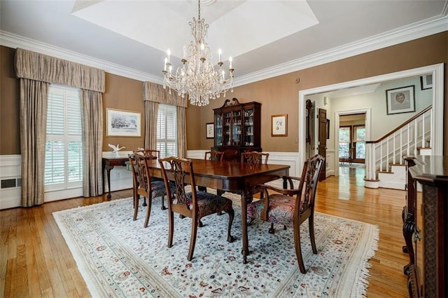 3030 Spalding Dr, Sandy Springs, GA 30350 - dining area with stairs, plenty of natural light, a tray ceiling, light wood-style floors, and wainscoting