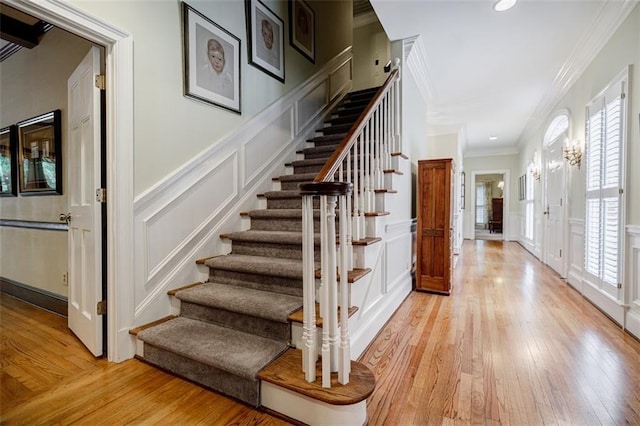 3030 Spalding Dr, Sandy Springs, GA 30350 - stairs with a decorative wall, ornamental molding, plenty of natural light, hardwood / wood-style floors, and a wainscoted wall