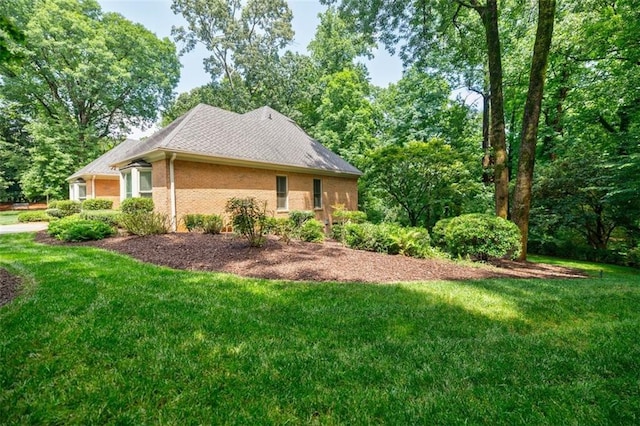 3030 Spalding Dr, Sandy Springs, GA 30350 - view of home's exterior with brick siding, a yard, and a shingled roof