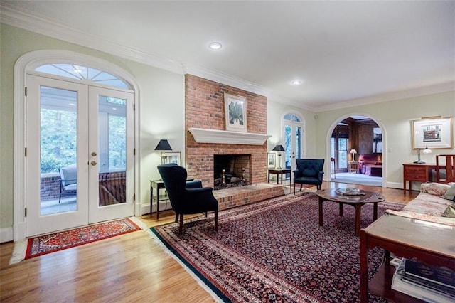 3030 Spalding Dr, Sandy Springs, GA 30350 - living area with french doors, wood finished floors, arched walkways, plenty of natural light, and ornamental molding