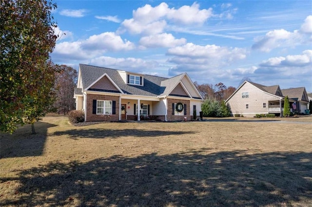 view of front of house featuring a porch and a front lawn