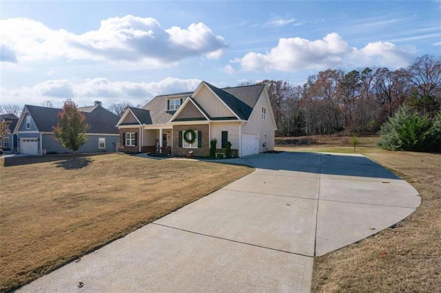 view of front facade featuring driveway, a garage, and a front lawn