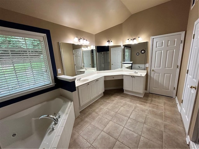 1038 Island View Ct, Buford, GA 30518 - bathroom with lofted ceiling, a whirlpool tub, double vanity, tile patterned floors, and a shower stall