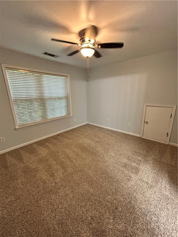 1038 Island View Ct, Buford, GA 30518 - empty room featuring ceiling fan, a textured ceiling, and carpet floors