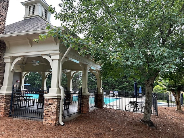 1038 Island View Ct, Buford, GA 30518 - view of patio / terrace featuring a community pool