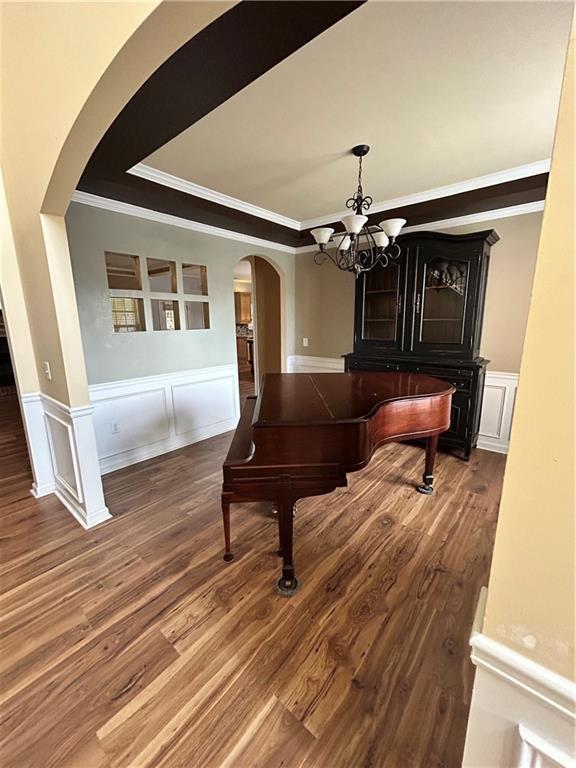 1038 Island View Ct, Buford, GA 30518 - hall with crown molding, dark wood-type flooring, and arched walkways
