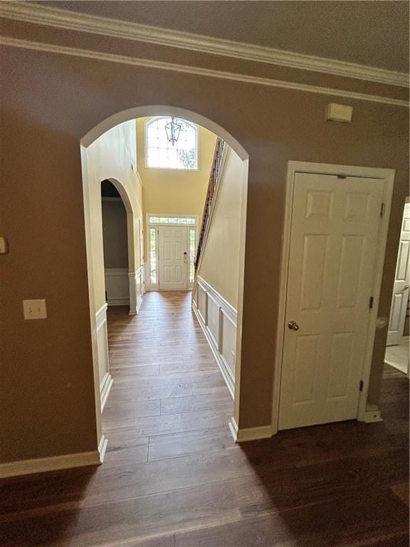 1038 Island View Ct, Buford, GA 30518 - corridor featuring arched walkways, ornamental molding, and dark wood-style floors