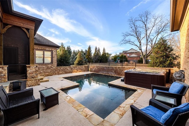 view of pool featuring a patio area and a hot tub